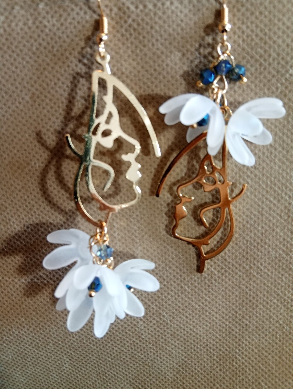 Gold Face Silhouette Earrings with White Petal Accents